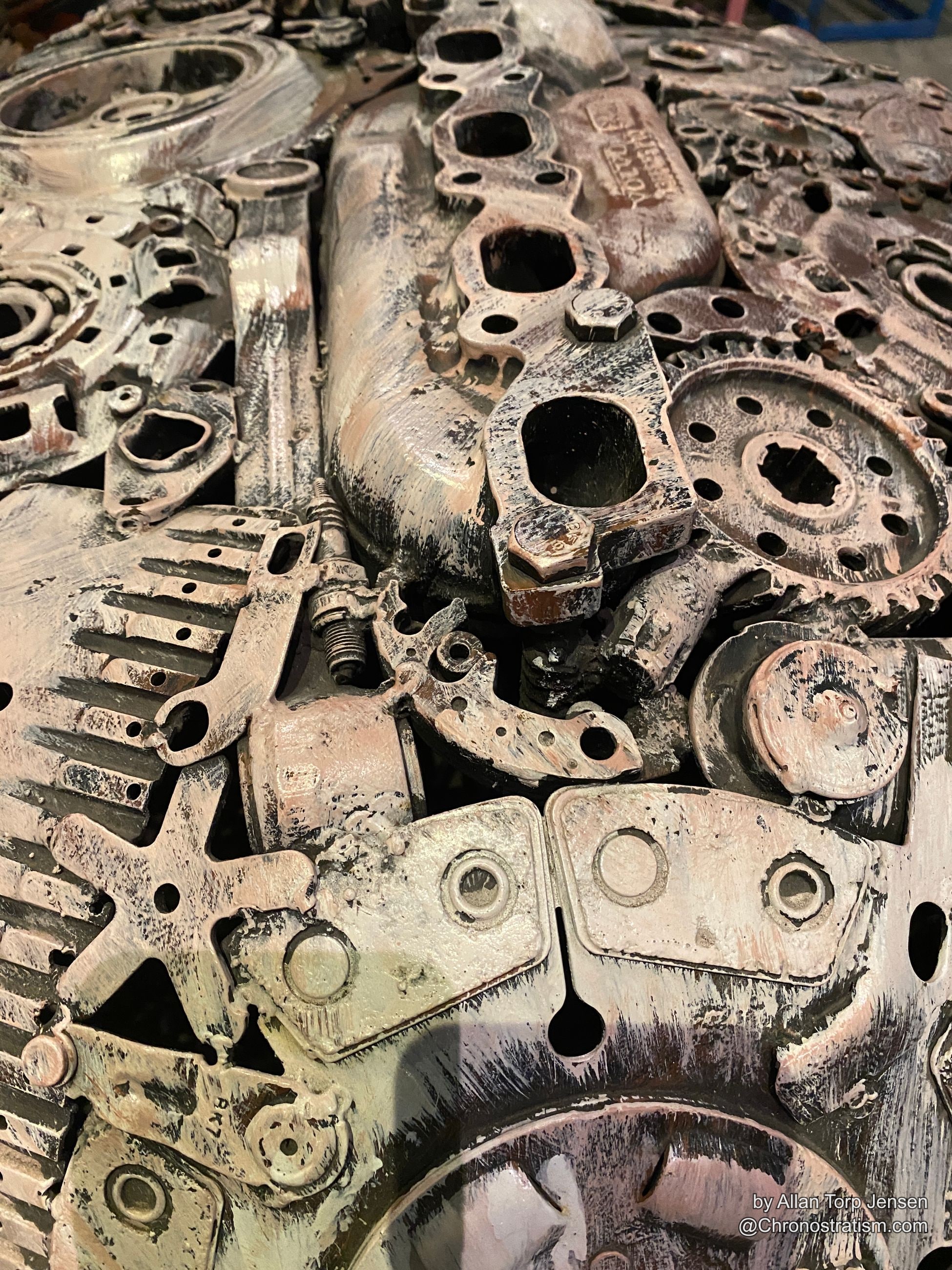 Pale, corroded cast-metal housings and gears stamped with part codes.