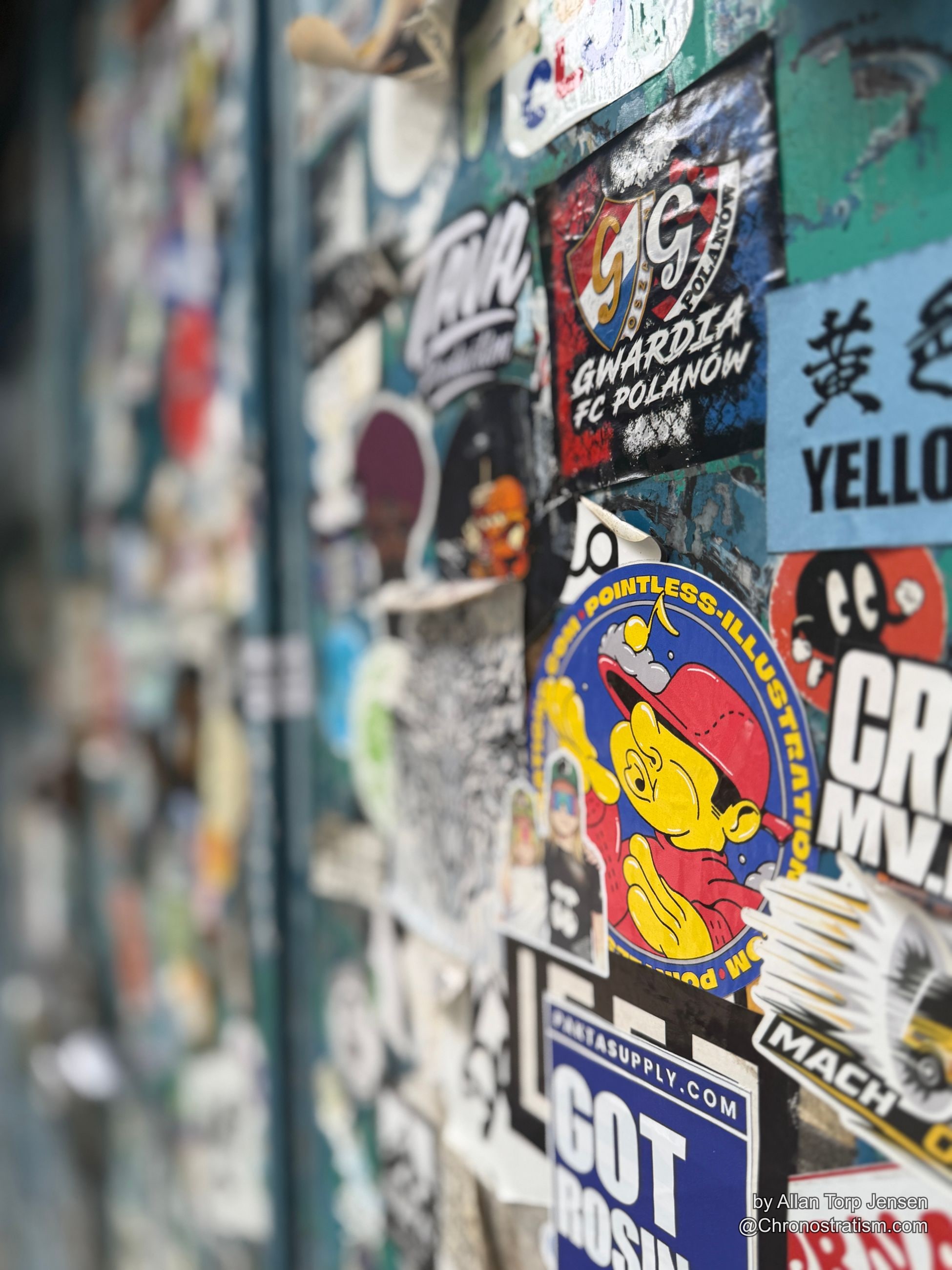 Sports and novelty stickers cluster across the door’s right panel.